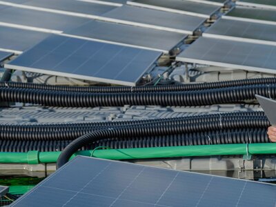An engineer working on a set of solar panels