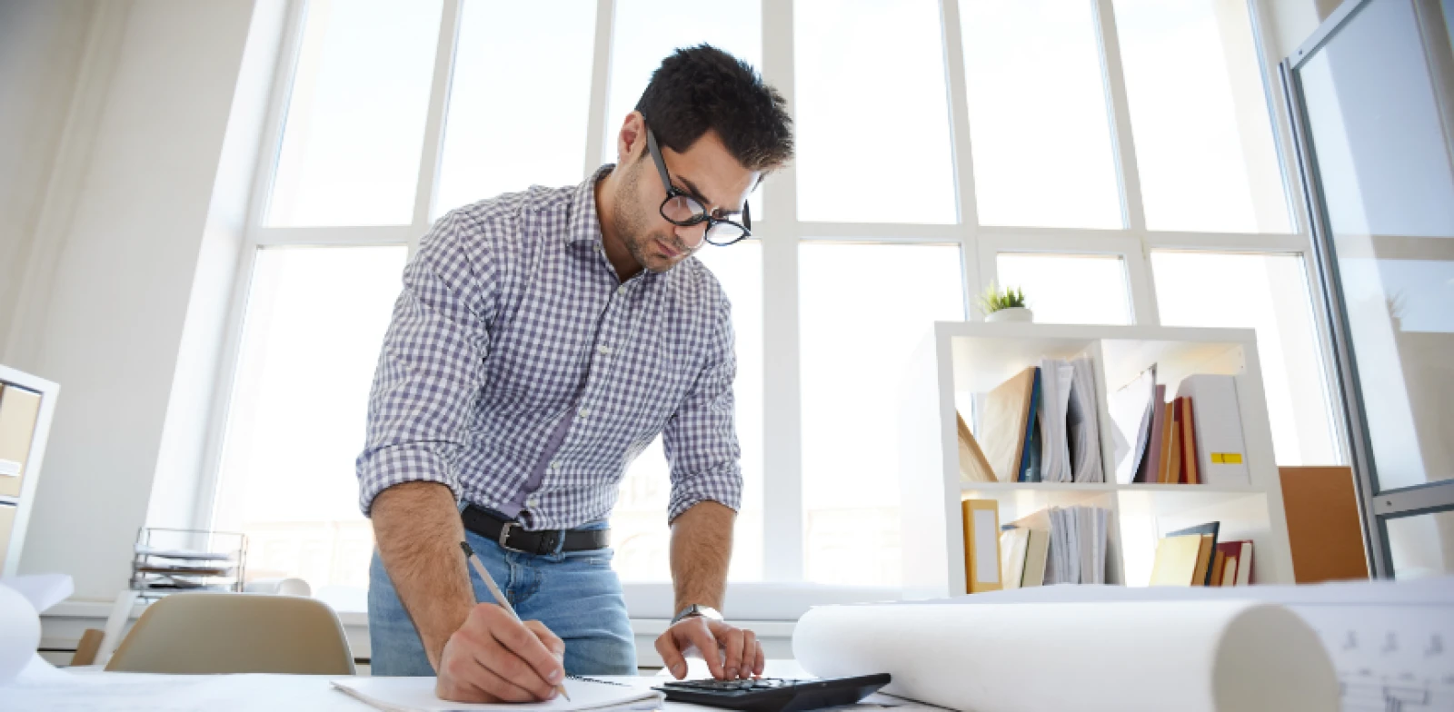 Man working on blueprints