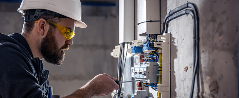 Man working on electrical solution